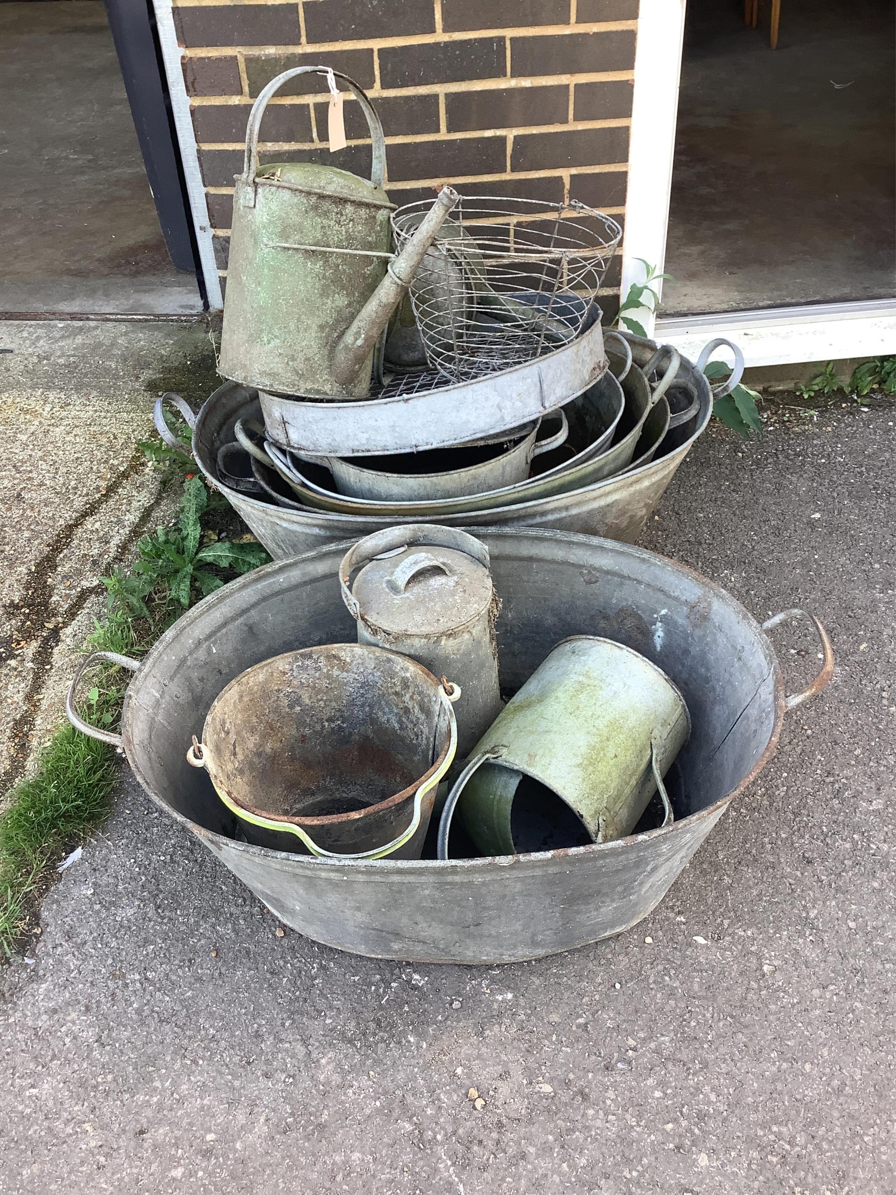 A quantity of galvanised containers watering cans etc., largest width 90cm. Condition - fair